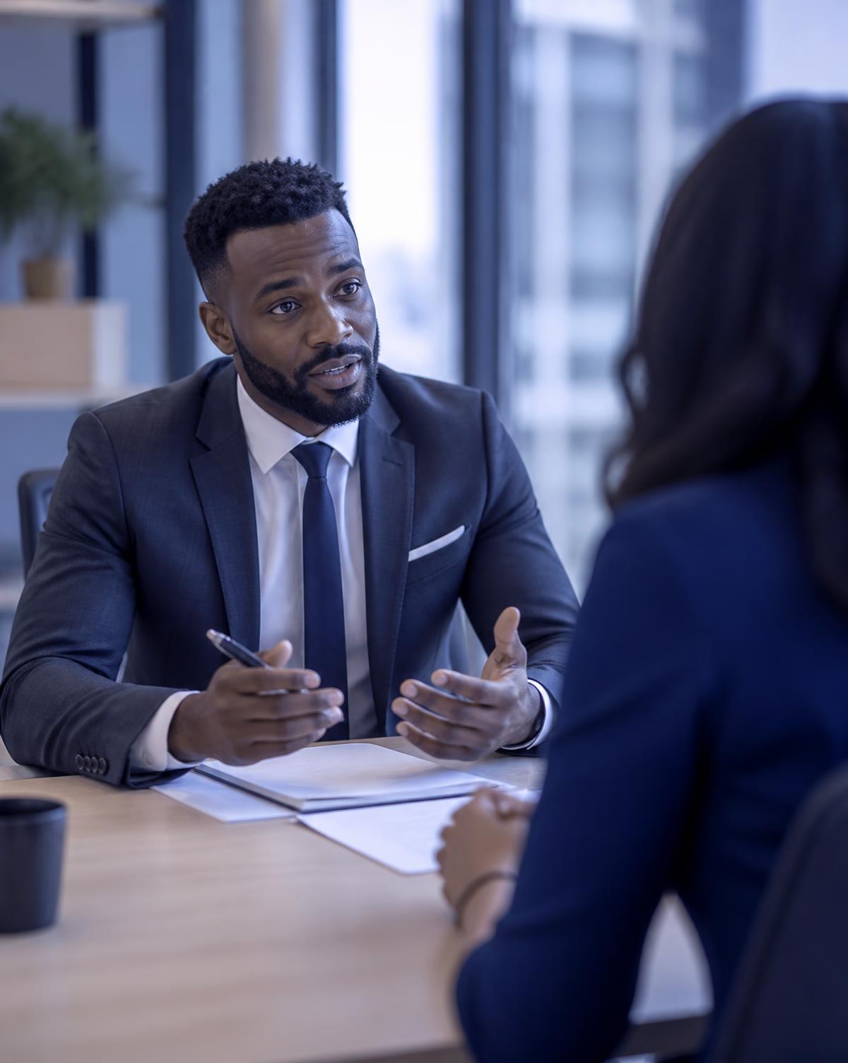 A Lucid Management consultant walking a client through their financial documents
